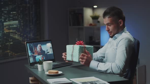 Brother and Sister Showing Each Other Their Received Presents From Parents on Video Call