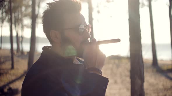 Businessman Leisure After Hard Working Day. Man Relaxing Outdoor And Smoking Sigarette.