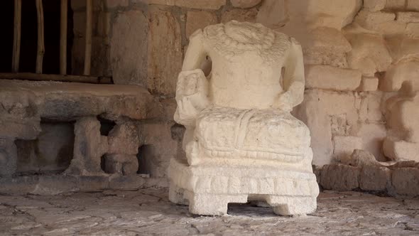 Camera moving to the right showing intricate sculpture of a warrior in the Acropolis at Ek Balam arc