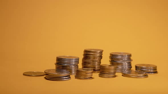 Rows of Money Coins on Gold Background