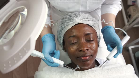 Beautician Makes Procedure for Clean Face with Hardware