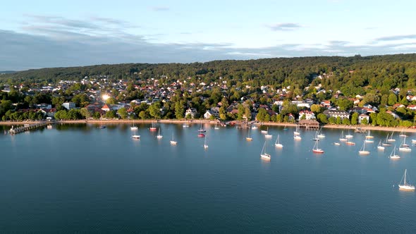 Aerial view flying drone of town Herrsching at Ammersee lake, luxurious residential area with high c