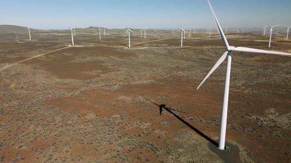 Windmill Propellers Spinning Fast Generating Electricity At Wind Farm