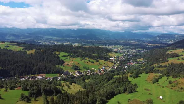 Flight Over a Mountain Cottage Village in Poland, Zakopany, Tatra National Park Aerial 4K Video