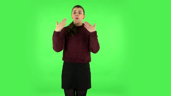 Young Tired Woman Cooling Herself By Her Hand, Suffering From High Temperature Weather. Green Screen