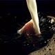 A Stream of Milk Pours Into the Black Coffee - VideoHive Item for Sale