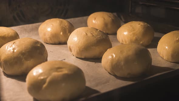 Baking Glazed Buns In A Hot Oven - zoom-out, time lapse