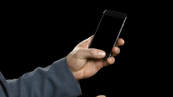 Businessman Flipping Page in a Smartphone.