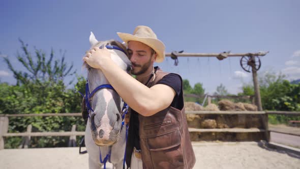 The man who kisses and loves his horse.