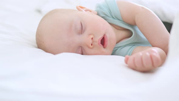 Closeup Portrait of Sleeping Infant Three Months Baby Closed Eyes White Bed