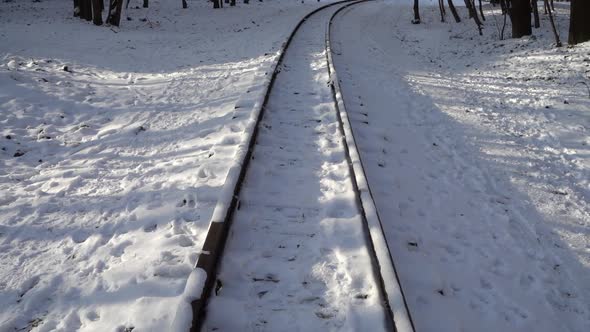 Railway rails covered with snow.