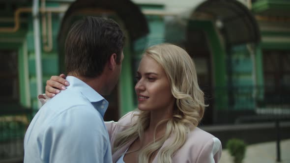 Closeup Couple Standing Together at Date Outside. Young Business Couple Hugging