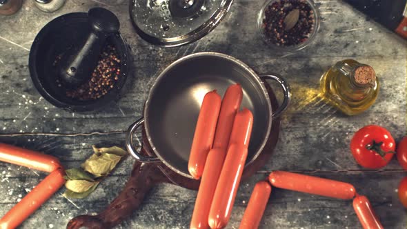 Super Slow Motion in the Pan Fall Sausages with Spray