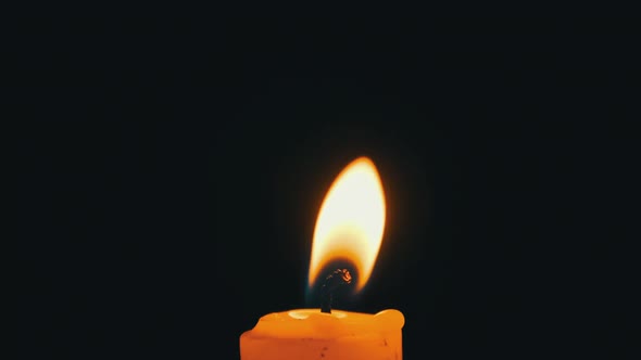 Candle Flame on Black Background Closeup