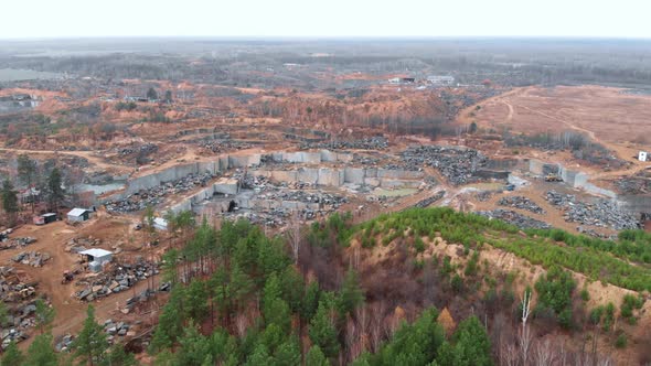 Granite walls in stone quarry. Granite pit.