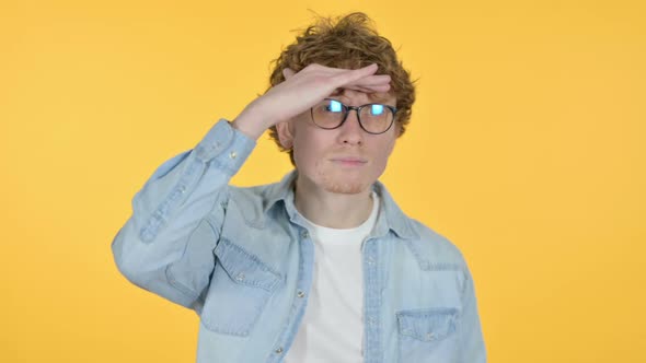 Searching Redhead Young Man Looking for Opportunity Yellow Background