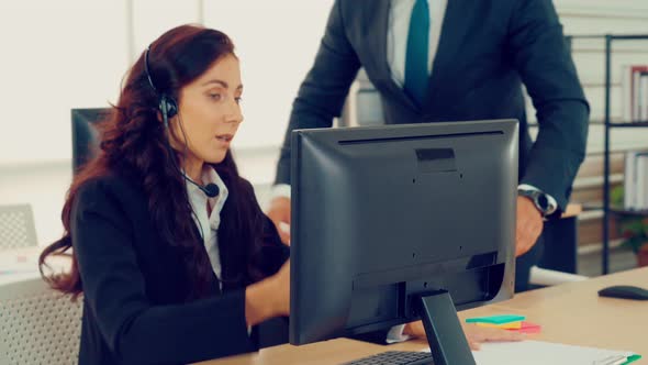 Business People Wearing Headset Working in Office