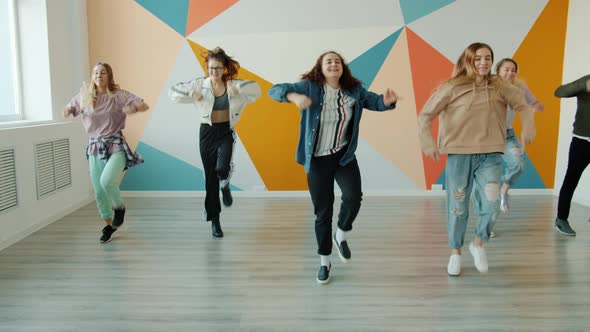 Joyful Teenagers Dancing in Dance Studio Training Indoors Having Fun in Leisure Time