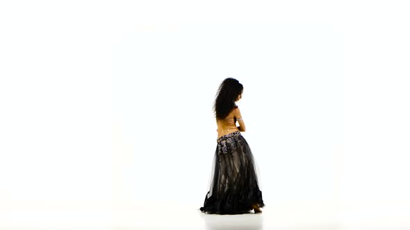 Beautiful Young Exotic Belly Dancer with Long Dark Hair in Unusual Suit Dancing, Wave of Hair, on
