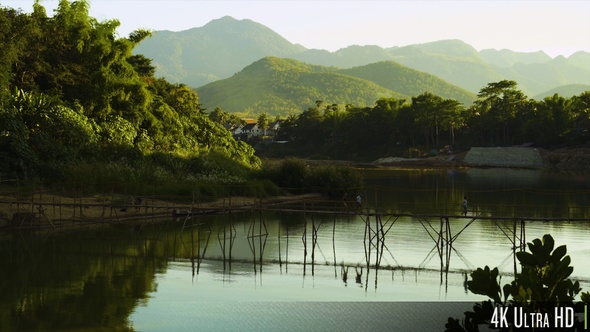 4K Picturesque Wooden Bridge Over a River in Southeast Asia