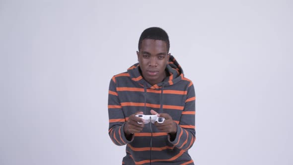 Young Tired African Man Playing Games and Falling Asleep