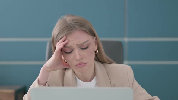 Close Up of Upset Businesswoman Working on Laptop