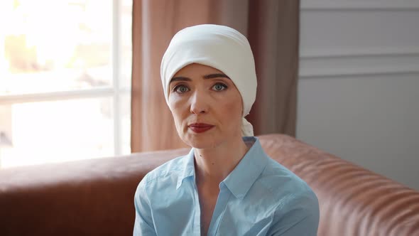 Female Wearing Headscarf During Chemotherapy Oncology Treatment In Clinic