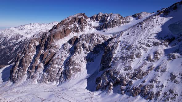 Drone View of the High Snowy Peaks of Kazakhstan