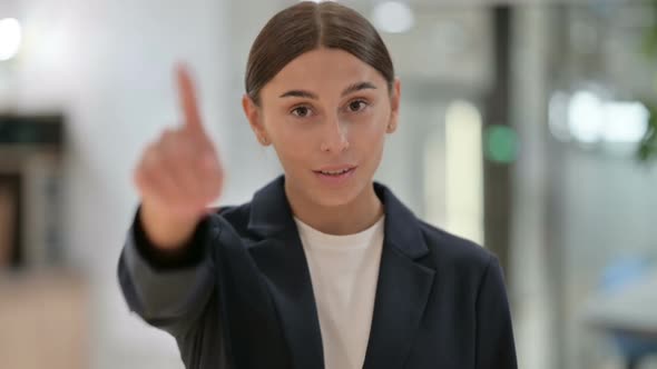 Portrait of Businesswoman with Pointing with Finger