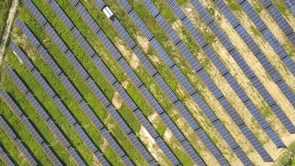 Aerial view of solar power plant field. Electrical photovoltaic panels for producing clean ecologic