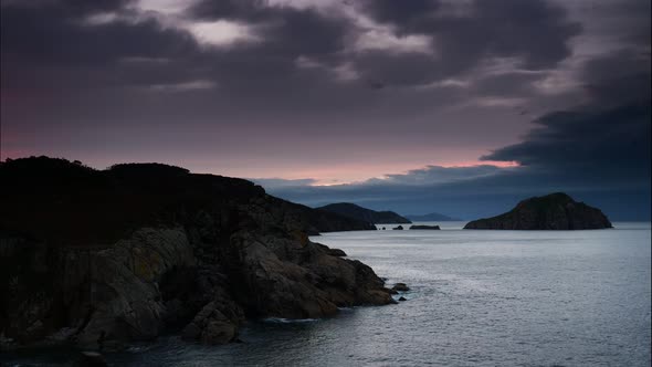 Dark Clouds Over Sea At Evening. Timelapse