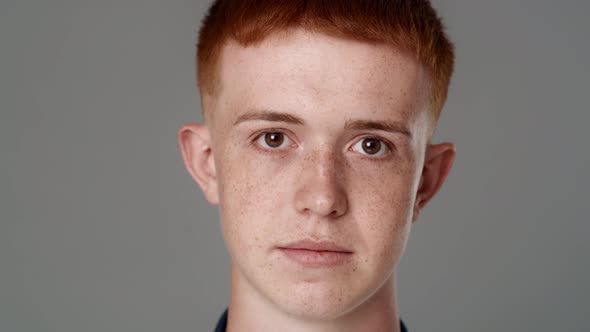 Close up portrait of serious red head caucasian teenage man. Shot with RED helium camera in 8K.