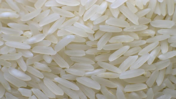 White Polished Long Rice Closeup in Macro Mode Rotates in a Circle