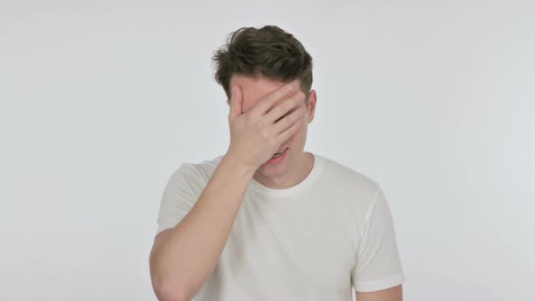 Disappointed Young Man Reacting Loss on White Background