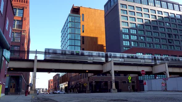 Elevated Subway Passing Over City Street and Buildings.