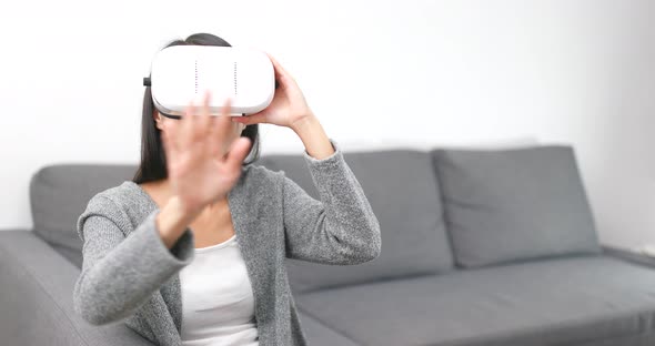 Woman look though virtual reality device