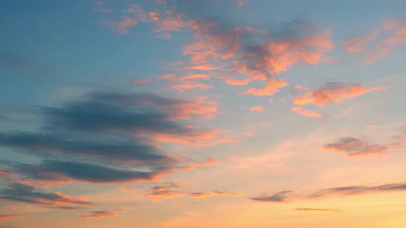 4K UHD : Time lapse of colorful sky during beautiful sunset. Romantic clouds.