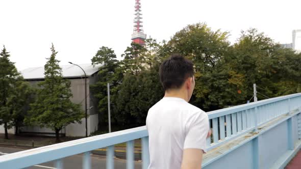 Middle-aged Japanese man exercises in Tokyo Japan