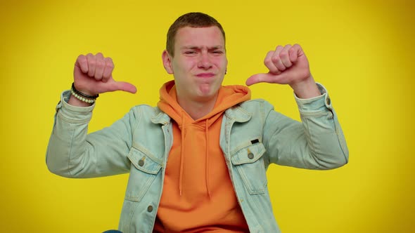 Upset Man in Denim Jacket Showing Thumbs Down Sign Gesture Disapproval Dissatisfied Dislike