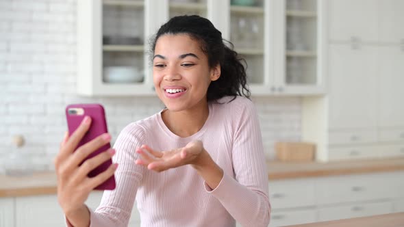 Mixedrace Female Blogger Saying Hi and Waving