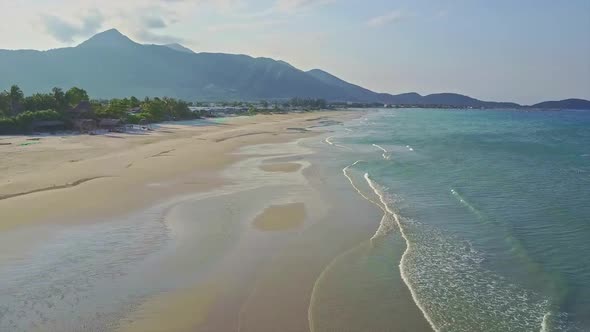 Flycam Moves Over Fantastic Wide Empty Ocean Beach