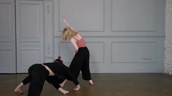 Ballet Dancers are Rehearsing Contemporary Dance Young Woman and Man are Dancing in Rehearsal Hall