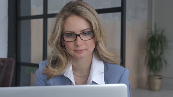 Businesswoman in Suit Smile and Using Laptop. Happy Female Worker Concept