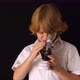 Young first graders experiment with microscope at home. against black background - VideoHive Item for Sale