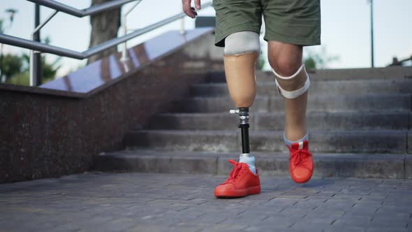 Front View Steps of Prosthesis in Slow Motion on Urban Stairs Outdoors