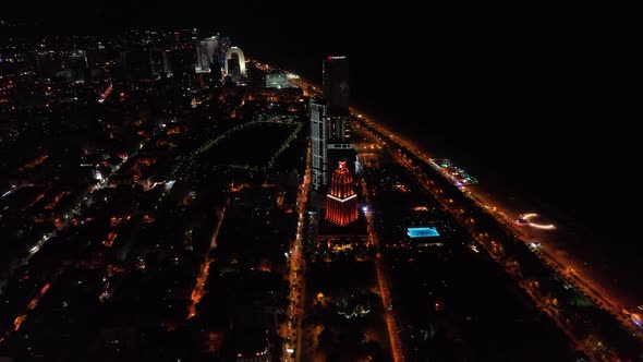 Top aerial view of beautiful lake in the center of Batumi at sunset. flying over 6 May park