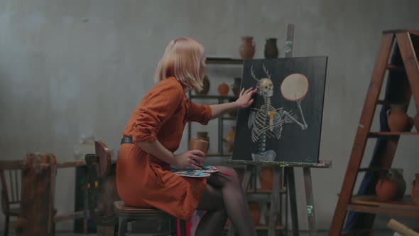 Gifted Female Painter Enjoying Finished Painting