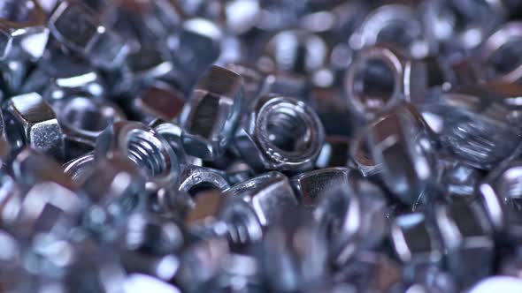 Metal Screwnuts Fall Neatly Into a Bunch of Other Nuts