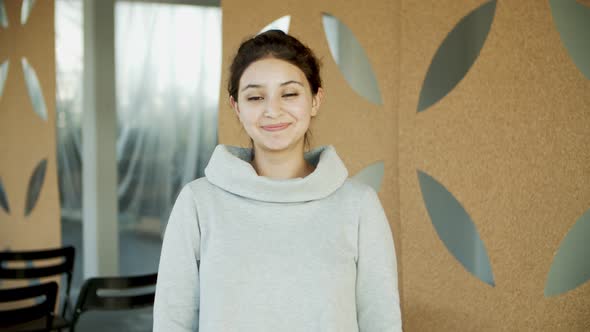 Medium Shot of Beautiful Young Woman with Toothy Smile