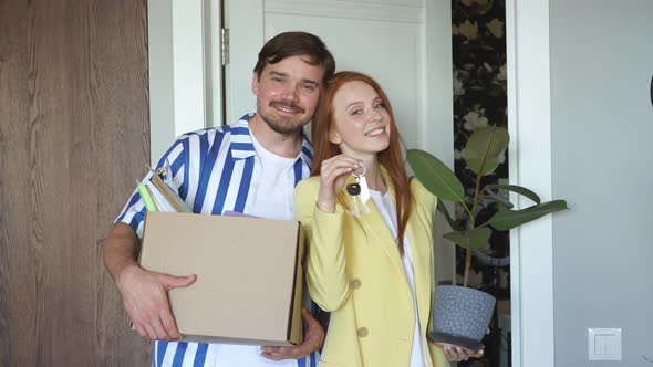 Portrait of Adorable Lovely Couple Moved To a New Apartment